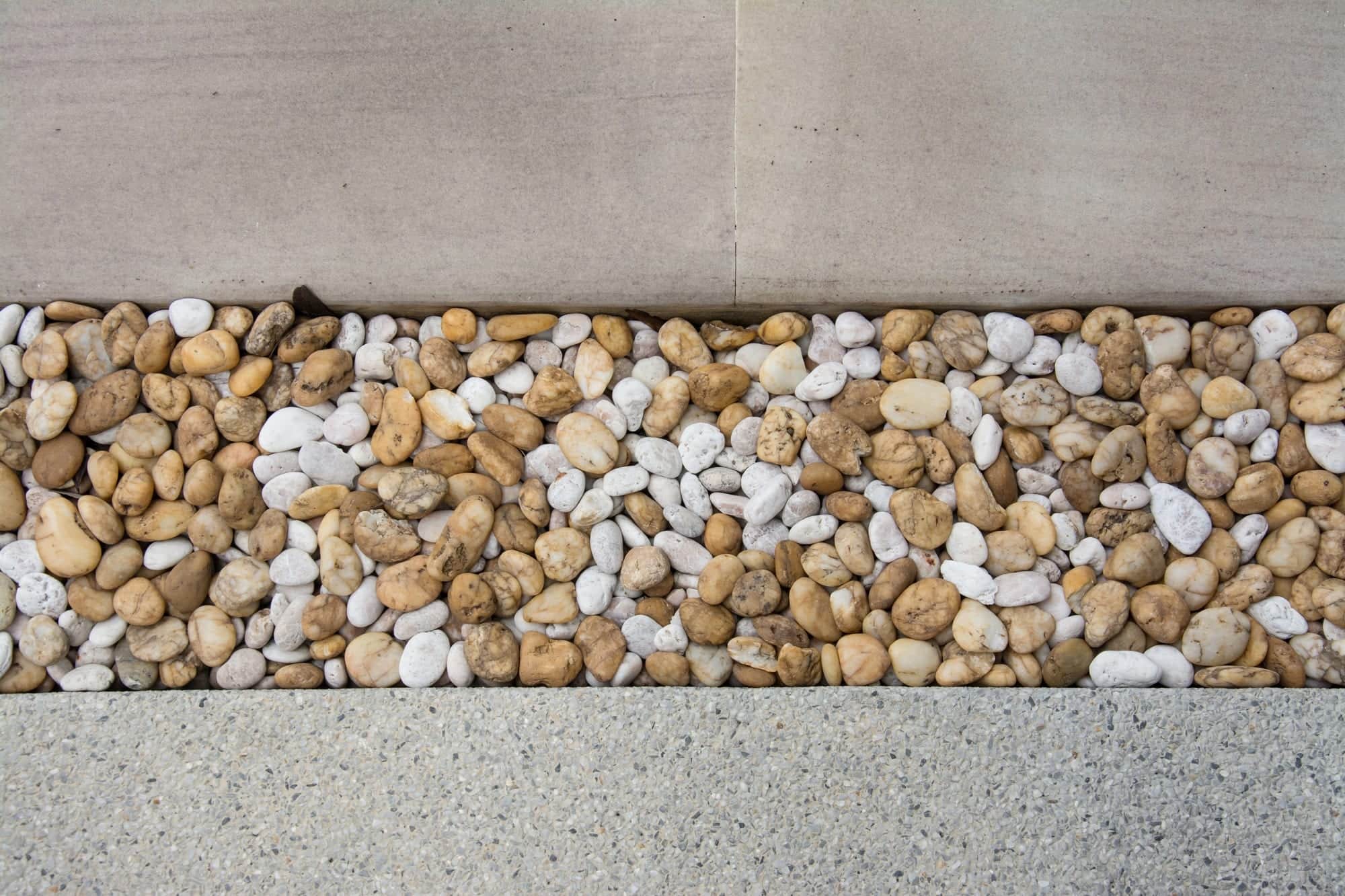A walkway pattern made with pebble tiles.