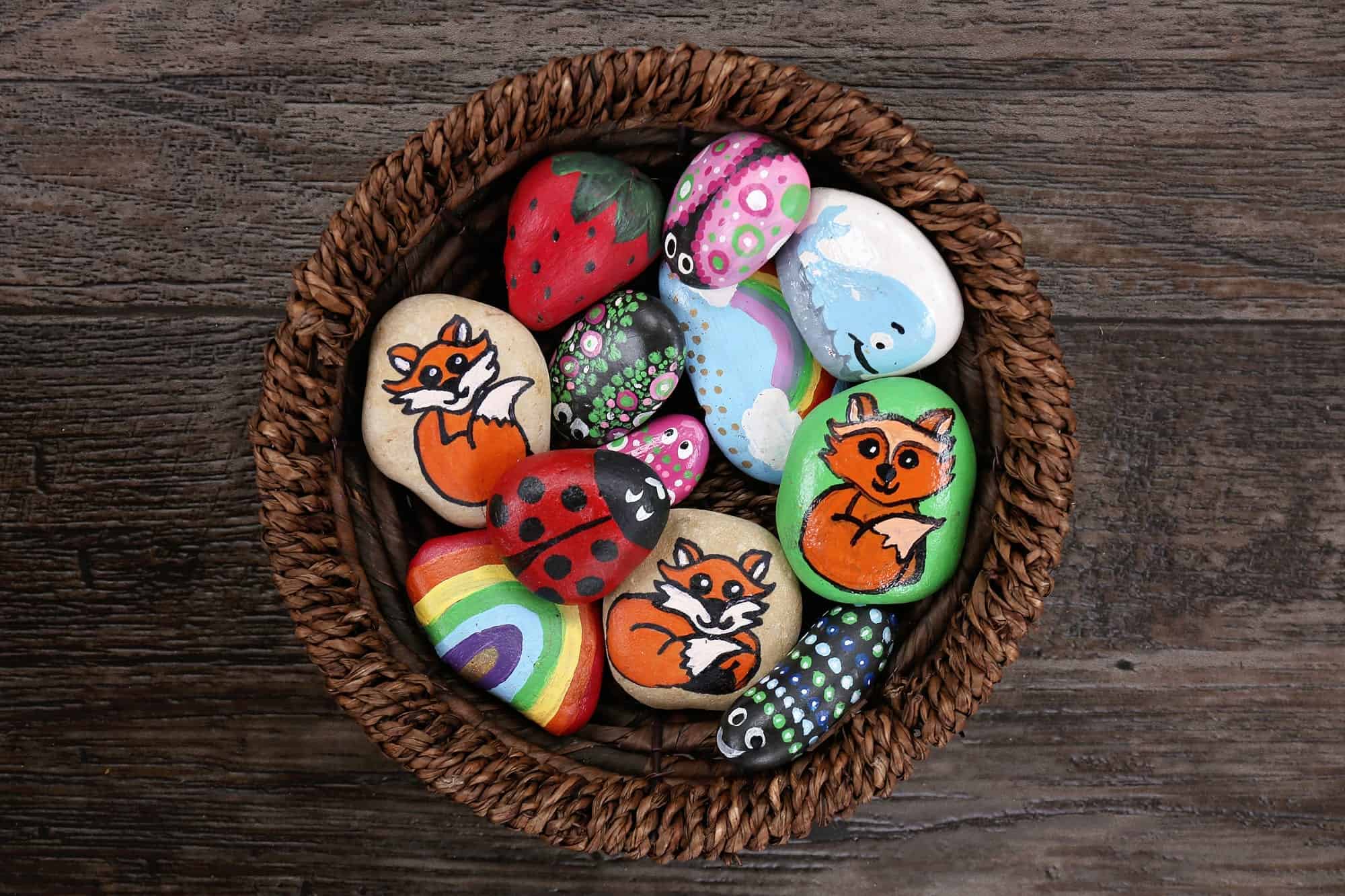 A basket of painted garden pebbles