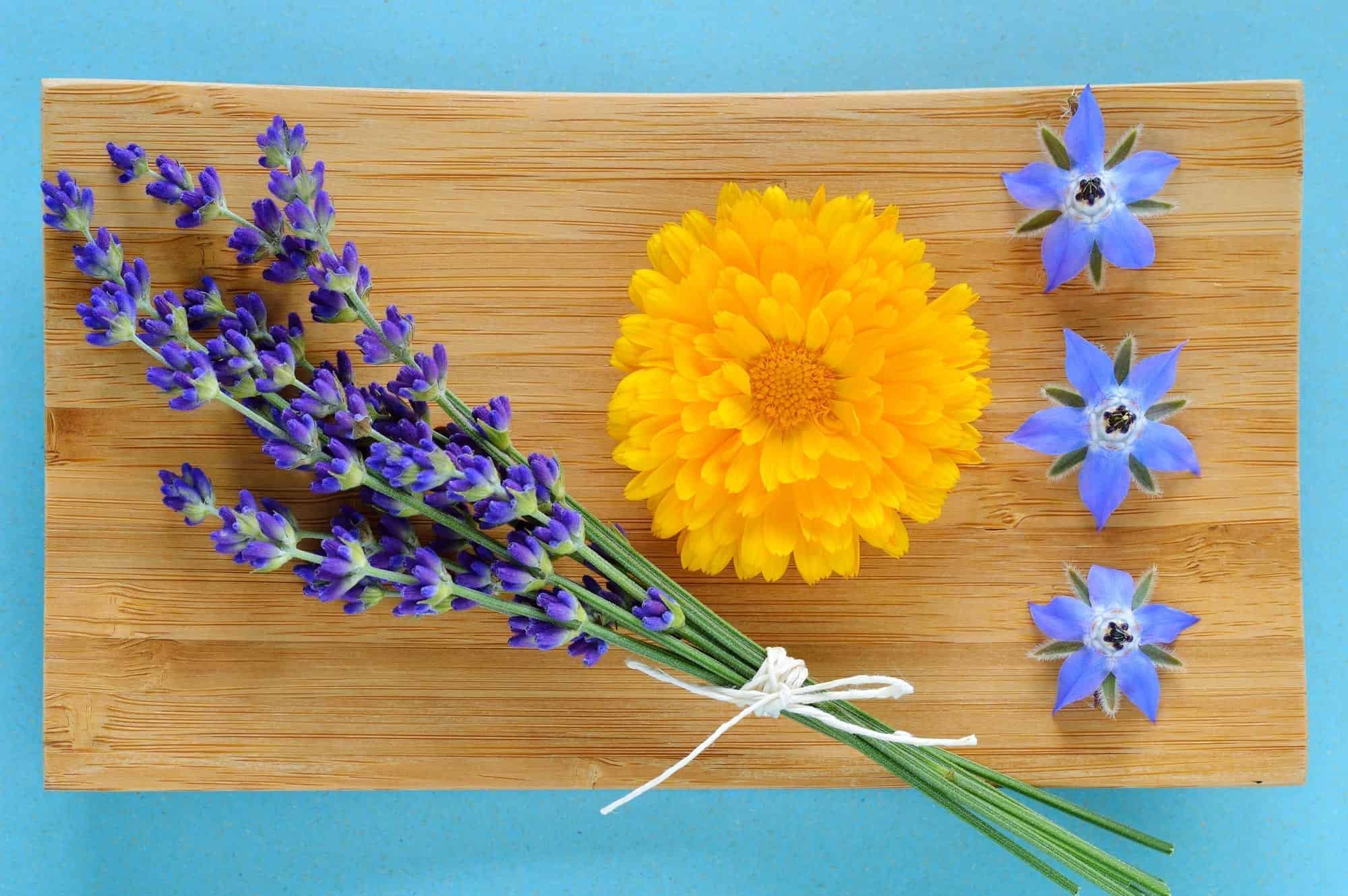 Edible flowers on a wooden board