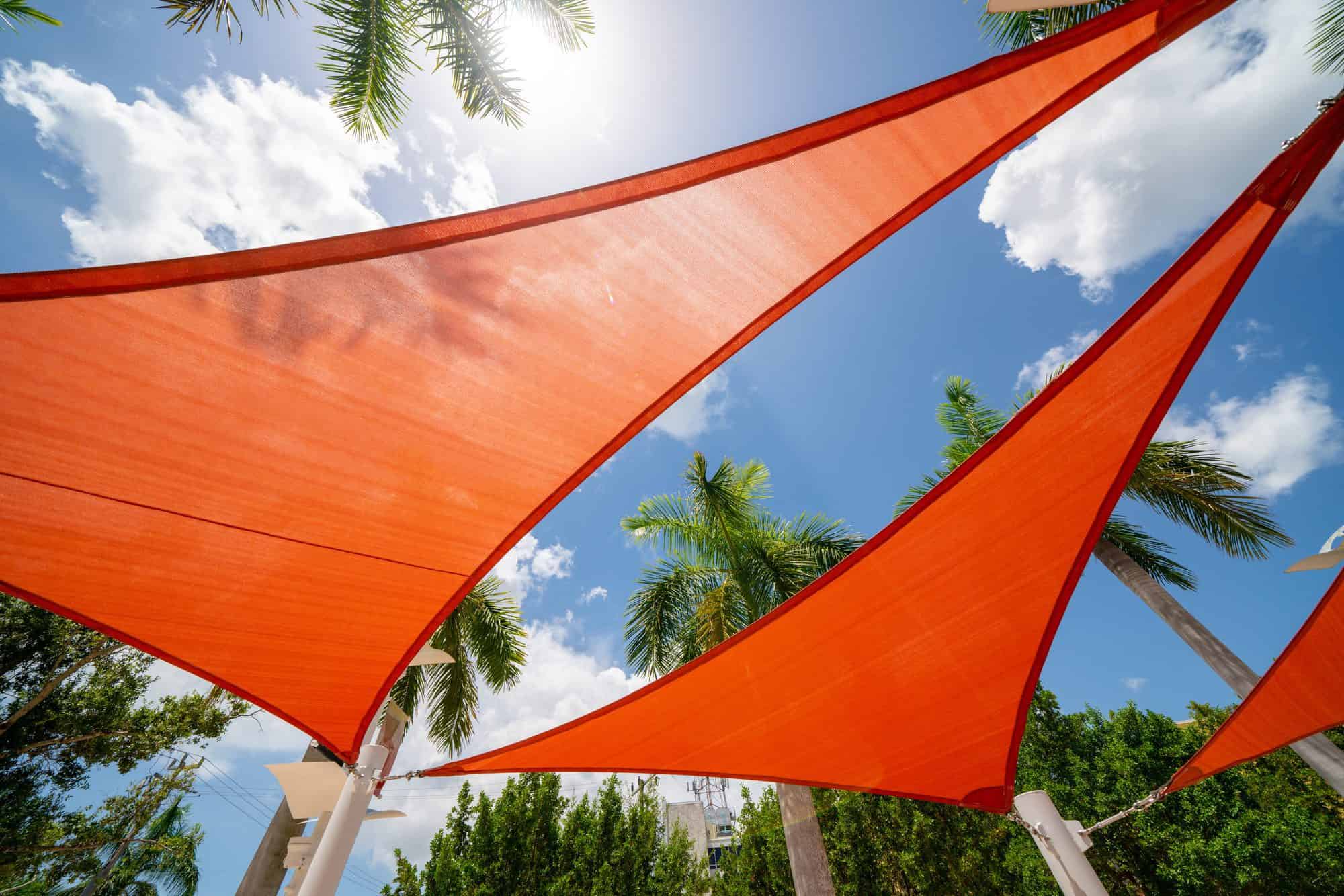 Orange colored sun shade in a park outdoors